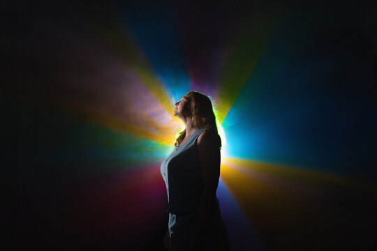  Portrait of adult woman in red and blue neon light. Rainbow mindset concept.