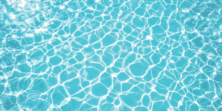 Bright blue swimming pool water surface with sunlight reflections and ripple patterns