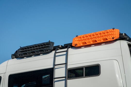 detail of 4x4 camper van with a ladder, roof racks and recovery ladders