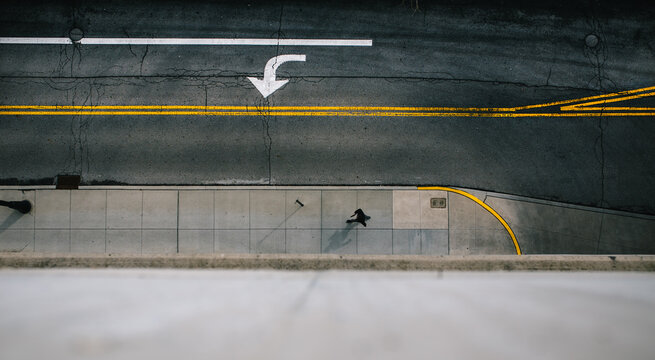 skateboarder performing tricks on a half-pipe ramp in an urban environment