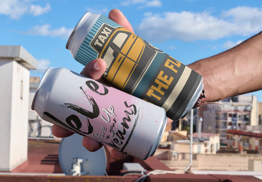 Mockup of Hands Hold Two Large Cans
