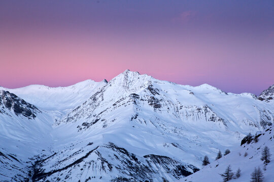 Beautiful Snow Covered Mountain Peaks
at Sunrise Sunset with Pink Dusk
Sky