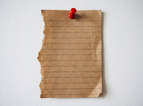 Torn paper sheet with pin