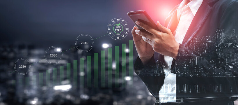 A businessman engages with a smartphone against a dramatic night skyline, featuring a growth chart and targets reflecting sustainable future goals and innovative strategies. Gantry