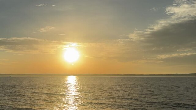 Beautiful morning sunrise over a calm ocean with an ample copy space on the right side