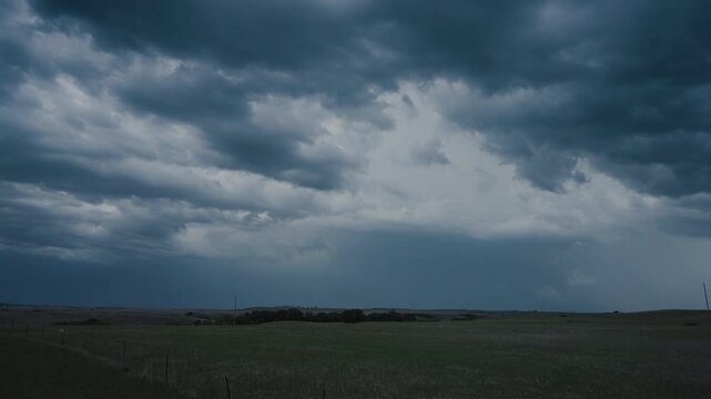 Deep thunderclouds lit by bright lightning in the darkness