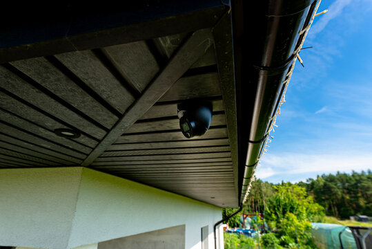 Dome security camera monitoring home exterior for safety