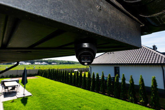 Dome security camera monitoring home yard for safety