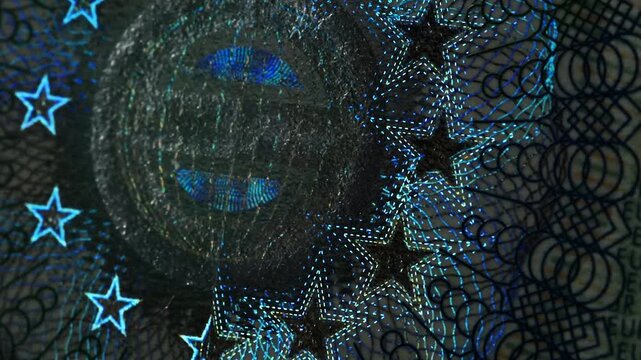 A close-up of the illuminated holographic emblem of the EU Schengen visa. The iridescent multicolor security hologram of the Schengen visa of the European Union countries. 4k slow motion video