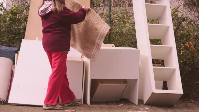 woman bringing old items bulky waste collection point, disposing belongings, recycling and donation culture, Sustainable lifestyle, responsible consumption and eco lifestyle, Fight against consumerism