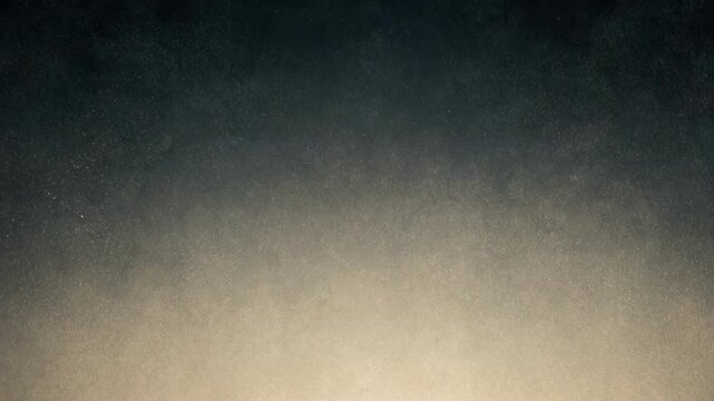 Dark textured background with light gradient and dust particles