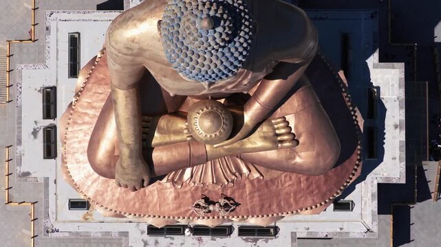 Aerial view of the massive golden Buddha Dordenma statue, a prominent landmark in the mountains of Thimphu, Thimphu, Bhutan.