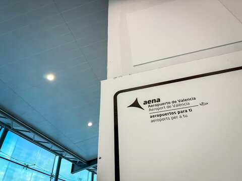 VALENCIA, SPAIN - FEBRUARY 28, 2026: Aena sign in Valencia Airport, or Aeropuerto de Valencia.Aeropuertos Espanoles y Navegacion Aerea is the public entity managing aviation and airports in spain.