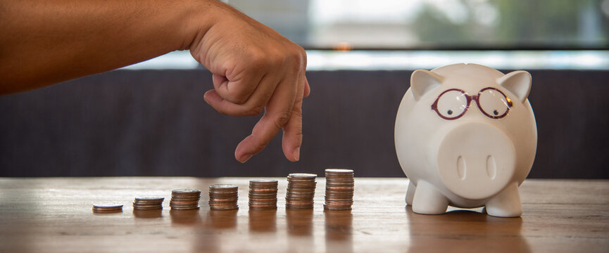 Banner women coin stack piggy bank saving account women planning coin stack wealth growth financial freedom investment budget retirement fund. Banner Hands hold coin stack budget planning copy space
