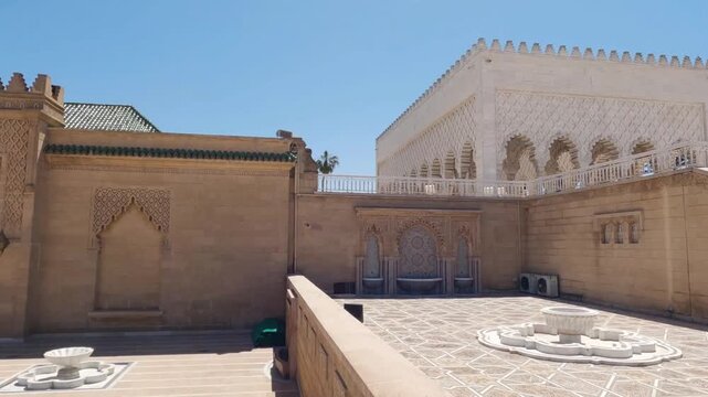 Morocco Rabat mausoleum of Mohammed V wide shot facade beautiful traditional moroccan architecture landmark monument tourism capital city in 4K Ultra HD footage.
