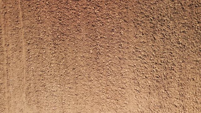 Drone aerial top view dry topsoil plowed supply chain sugar cane field eco farm net zero waste rural plant crop. The way forward asia go green carbon credit neutral ESG SDGs farmer agribusiness land.
