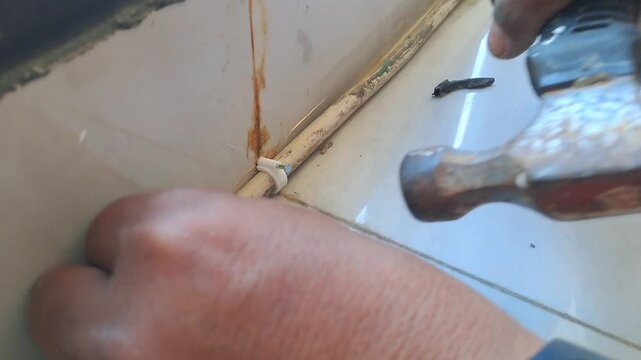 Technician connecting electrical wires for outlet using pliers and hot glue gun. Wiring installation and insulation process. Electrician stock video 4K for DIY, renovation, safety, construction, maint