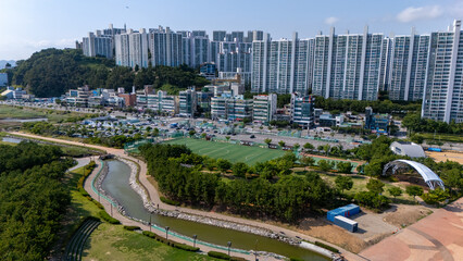 Urban landscape integrating residential high rises and park amenities in busan © Travel To Exist