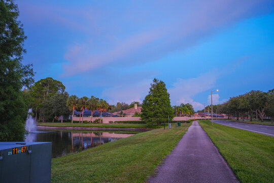  a florida community pond with sunset and colorful cloud