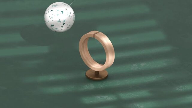 Pendulum loop movement with metallic sphere swinging rhythmically in seamless hypnotic motion pattern in 4K Ultra HD footage.
