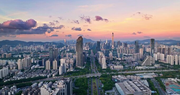 Aerial view of city skyline with modern skyscrapers at sunset in Shenzhen, China