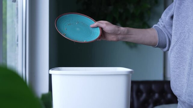 Man throwing away leftover cake, food waste concept