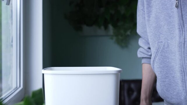 Person throwing away leftover dessert from fridge, food loss