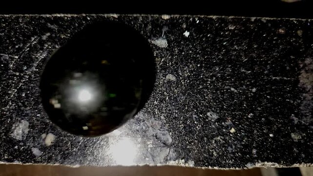 Glass Sphere Rolling Across Black Marble Surface in Slow Motion, Physics, Gravity, Motion, Balance, Minimal Abstract Background, Precision Movement