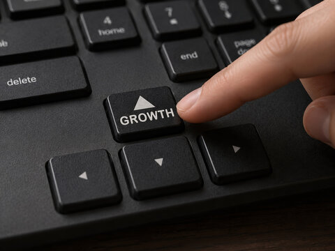Finger Pressing Growth Key on Keyboard as Business Growth Concept