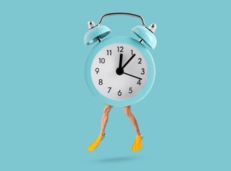 Alarm clock with human legs wearing flippers on blue background © Pixel-Shot