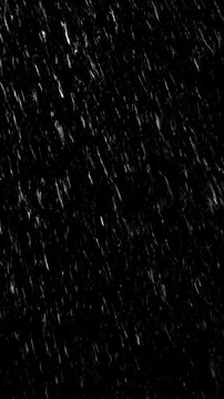 High-quality closeup video showing rain drops falling against a dark background capturing natural rainfall and wet weather effects.
