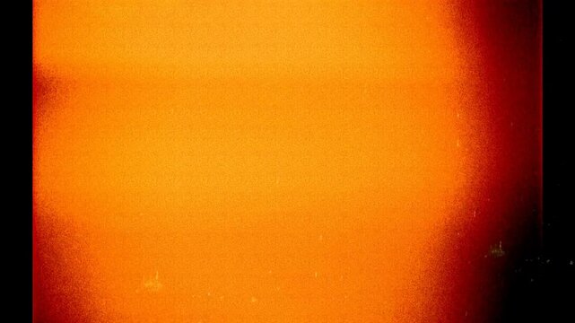 Vintage Photo Filmstrip With Orange Light Leak And Noise Flickering Background 4K
