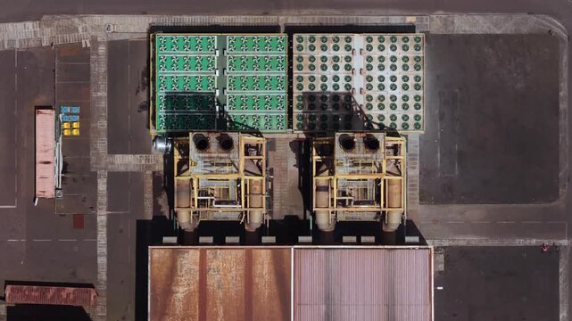Aerial view of the industrial facility of Tecnovia Acores with cooling fans and machinery in Rabo de Peixe, Acores, Portugal.