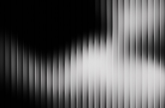 Abstract monochrome background with vertical striped texture and dramatic light and shadow play creating a modern design