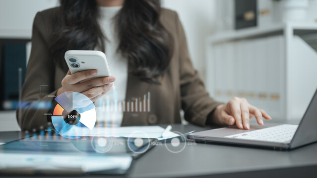 Professional reviewing analytics dashboards on smartphone and laptop with visual charts and business data insights. Ideal for big data, business intelligence, AI analytics, reporting systems.
