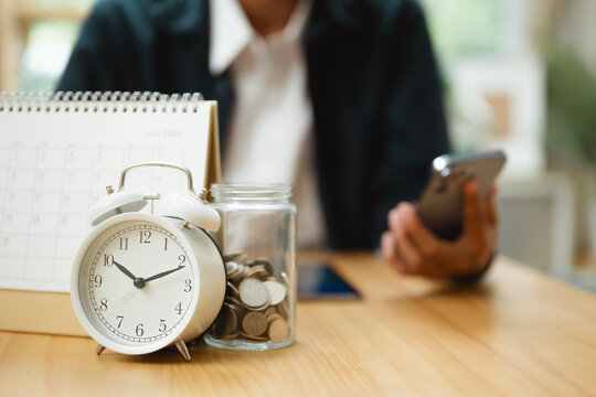 Alarm clock, calendar, and savings jar represent bill payment reminders, budgeting, and financial organization.