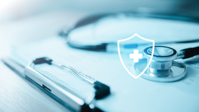 Health insurance concept featuring stethoscope, medical clipboard, and protection shield symbolizing healthcare coverage, patient benefits, and financial security.