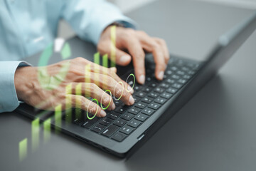 Business professional analyzing ESG performance and sustainability metrics on a laptop with digital...