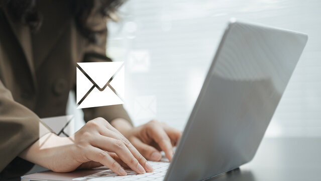 Business user managing email communication on a laptop, representing digital marketing, online messaging, customer engagement and cybersecurity awareness.