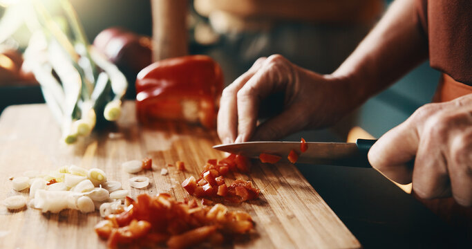 Kitchen, cutting and hands of couple for cooking, cuisine and meal prep for dinner or lunch. Marriage, home and people with knife, vegetables and ingredients for recipe, culinary skills and help