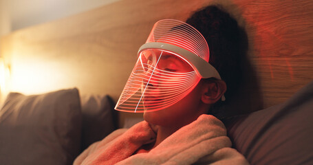 Red light, mask and woman in bedroom with skincare for beauty, wellness and collagen production....