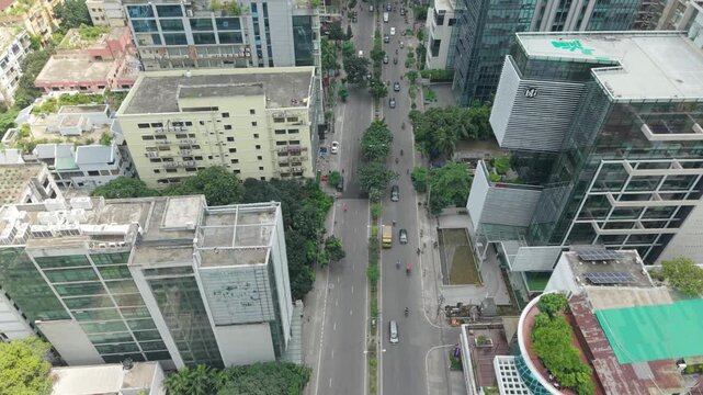 Road Intersection Aerial View of an Urban City District with Traffic Lanes, Buildings, Trees, and Pedestrian Areas