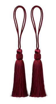 Pair of burgundy tassel decorations with loops isolated on transparent background