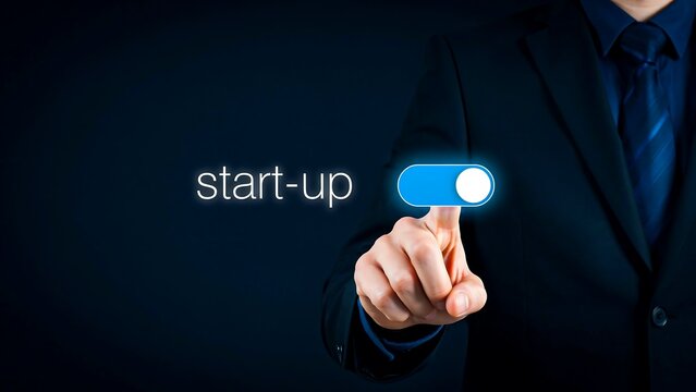 Businessman switching startup button for business launch and innovation
