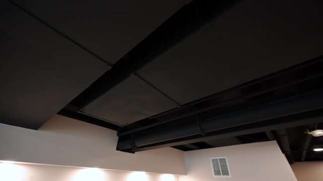 Element of black ceilings after the renovation of basement, wide move camera footage