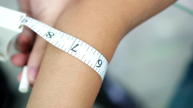 Pharmacist Measuring Upper Arm Circumference with Measuring Tape Real Footage