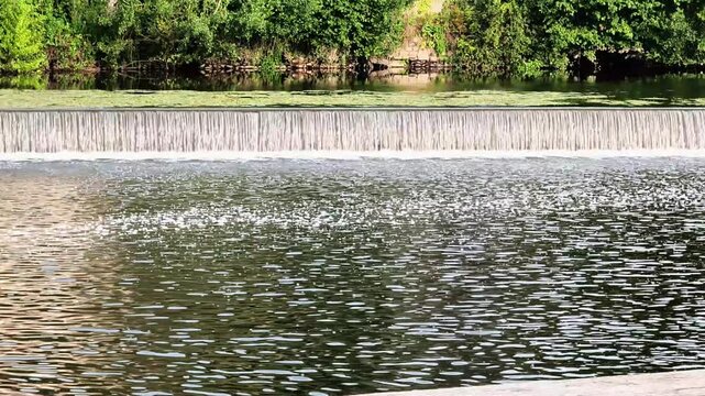 Water Flowing Over Weir in Forest River