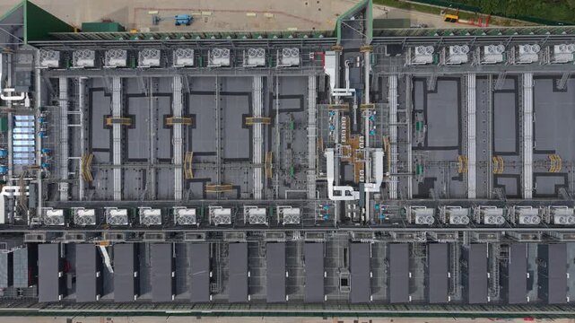 Aerial view of a data center featuring rows of cooling units and industrial infrastructure on the rooftop in London, London, United Kingdom.