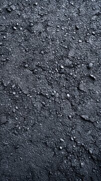 Dark gravel and pebbles scattered across ground surface