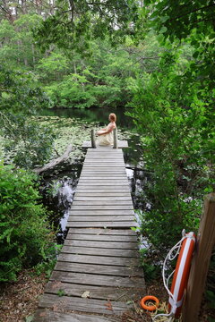 girl sitting on dock